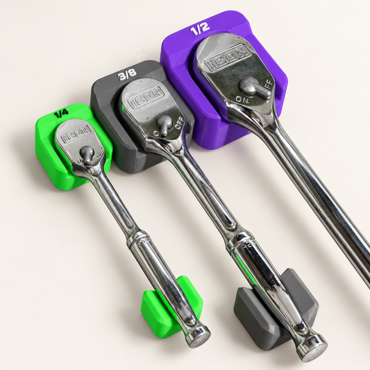 Studio rendering of three ratchets in green, gray and purple slim holders, viewed at an angle.